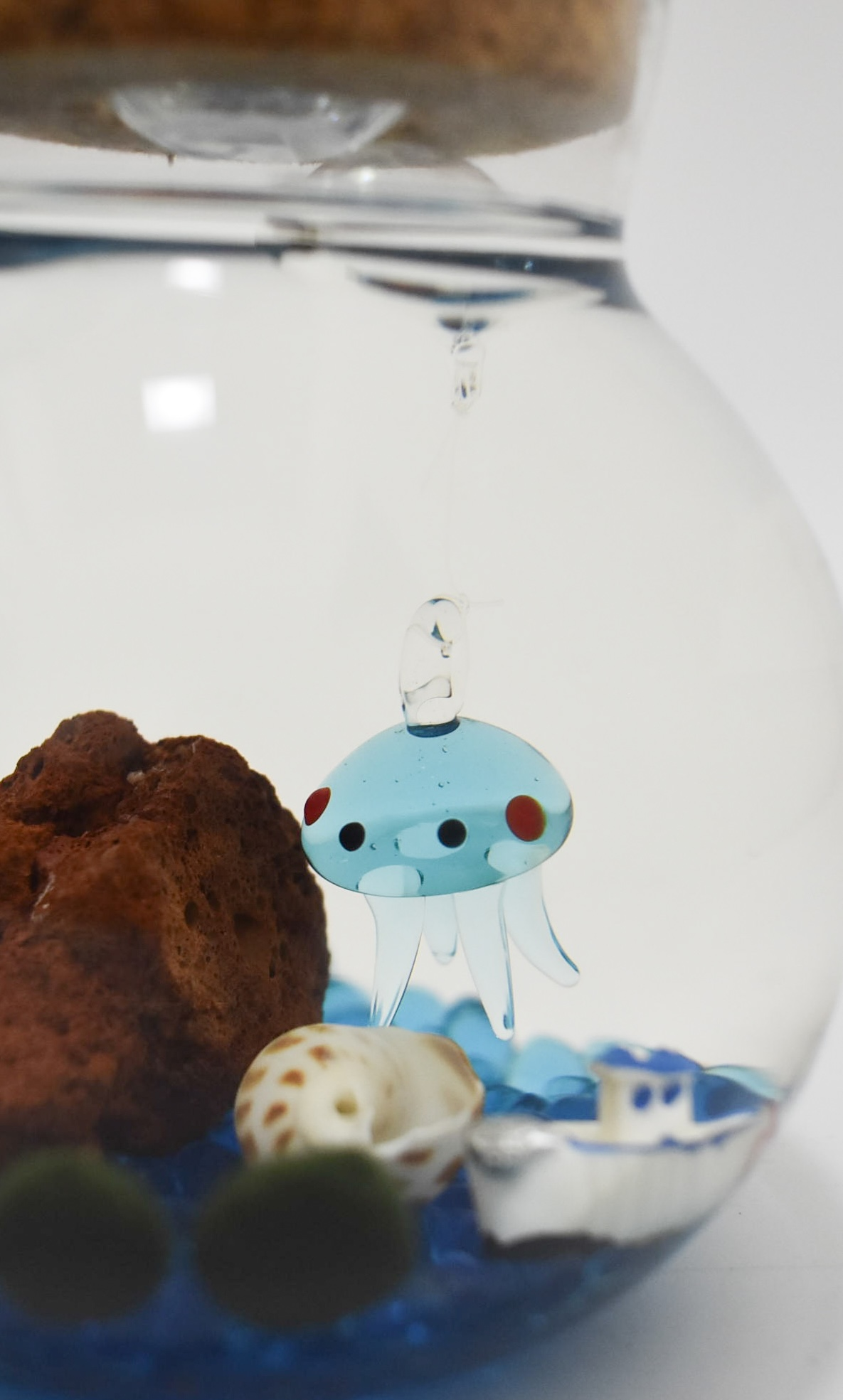 Floating glass figurine